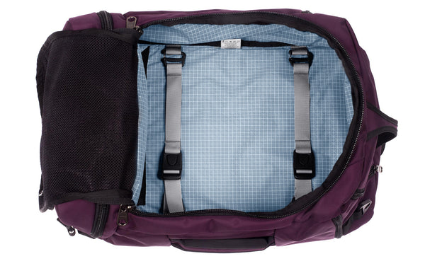 An open Techonaut 45 with an Aubergine (red-ish purple) exterior and a Tidal (pale blue with white grid) interior.